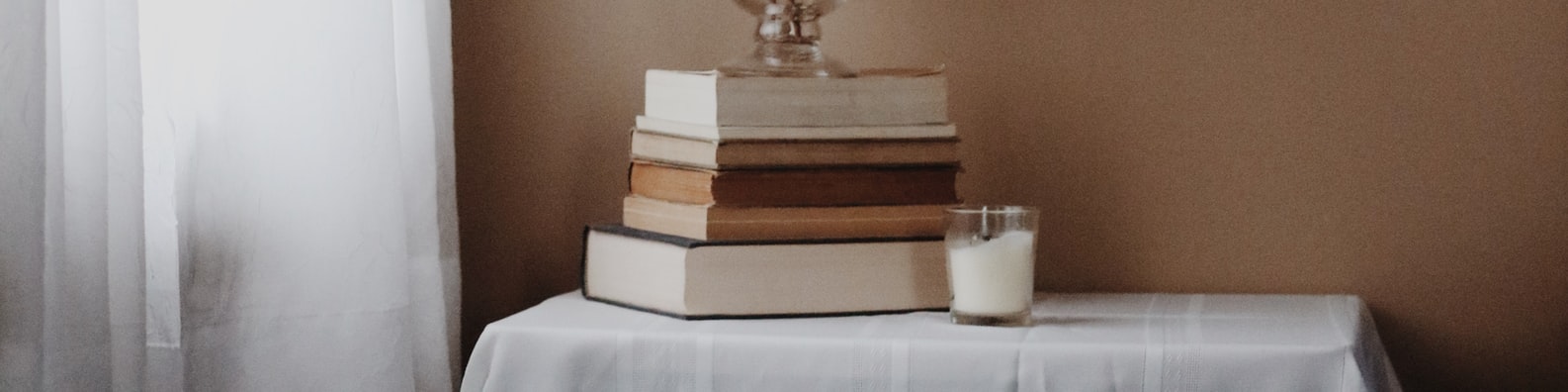 Abstract LinkedIn Cover Photo with Books_and_candles_on_the_table