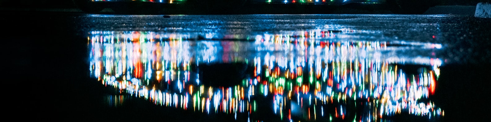 Abstract LinkedIn Cover Photo with Reflection Of The Colorful Lights On The Water