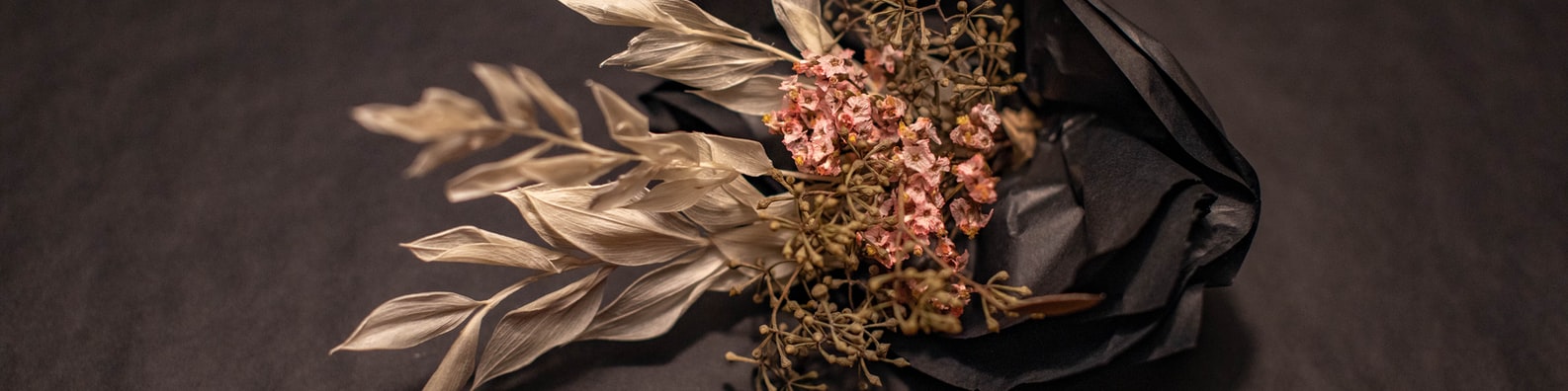 Abtract LinkedIn Cover Photo with Dried Flowers In Black Crumpled Wrap