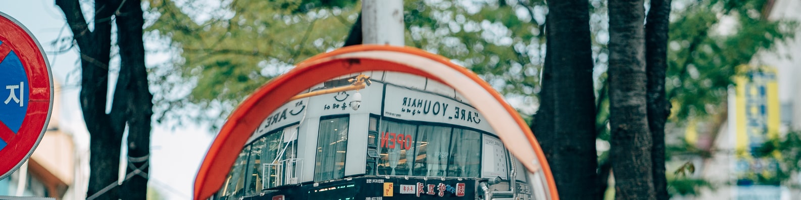 Urban LinkedIn Cover Photo with Reflection Of A Korean Hair Salon