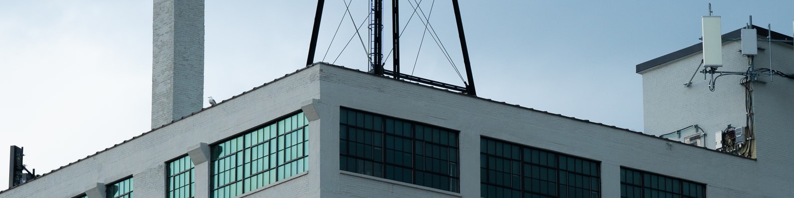 Urban LinkedIn Cover Photo with White Building With Blue Windows